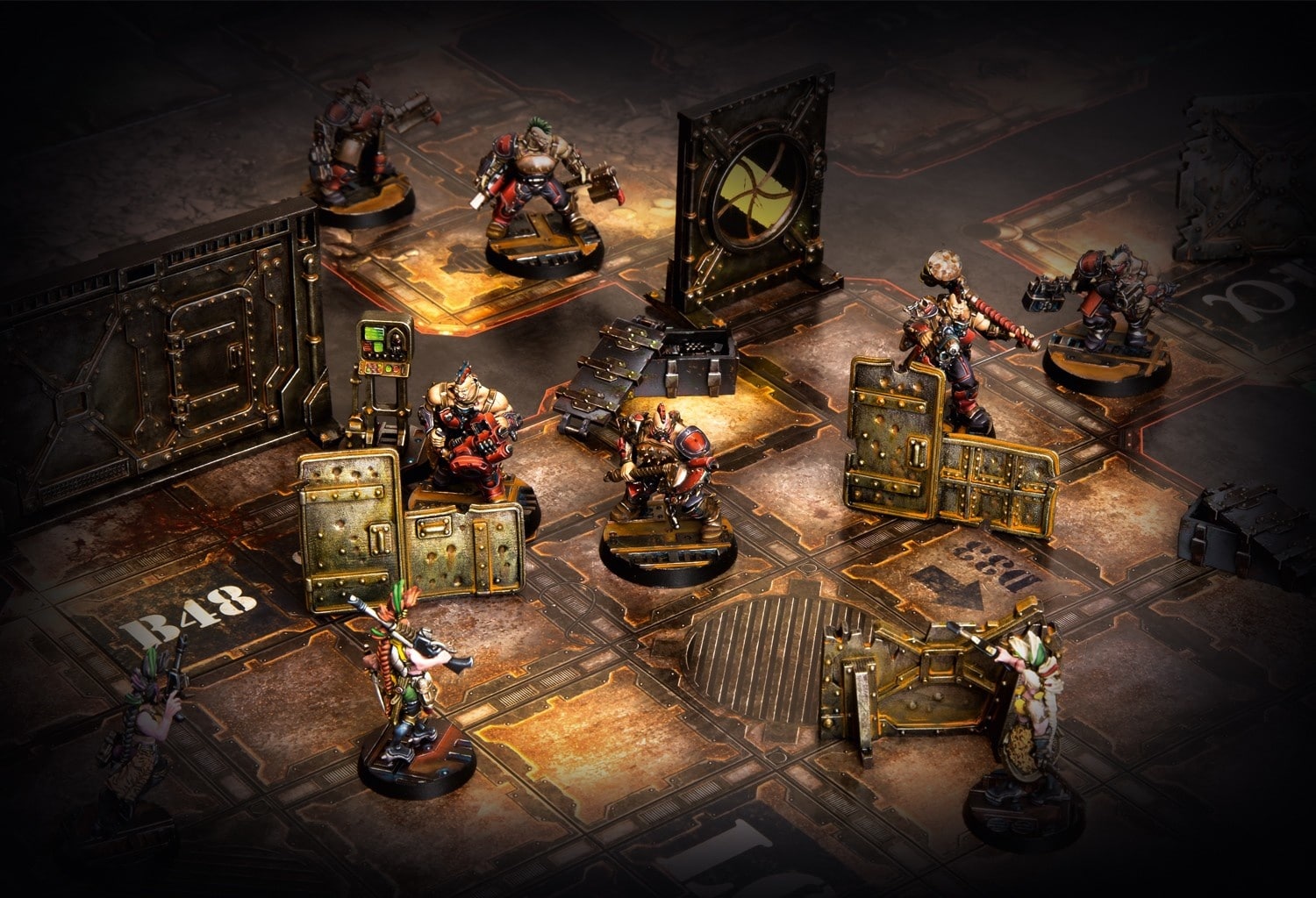 (Two gangs fight each other in the Necromunda scenario under the protection of various terrain buildings.)